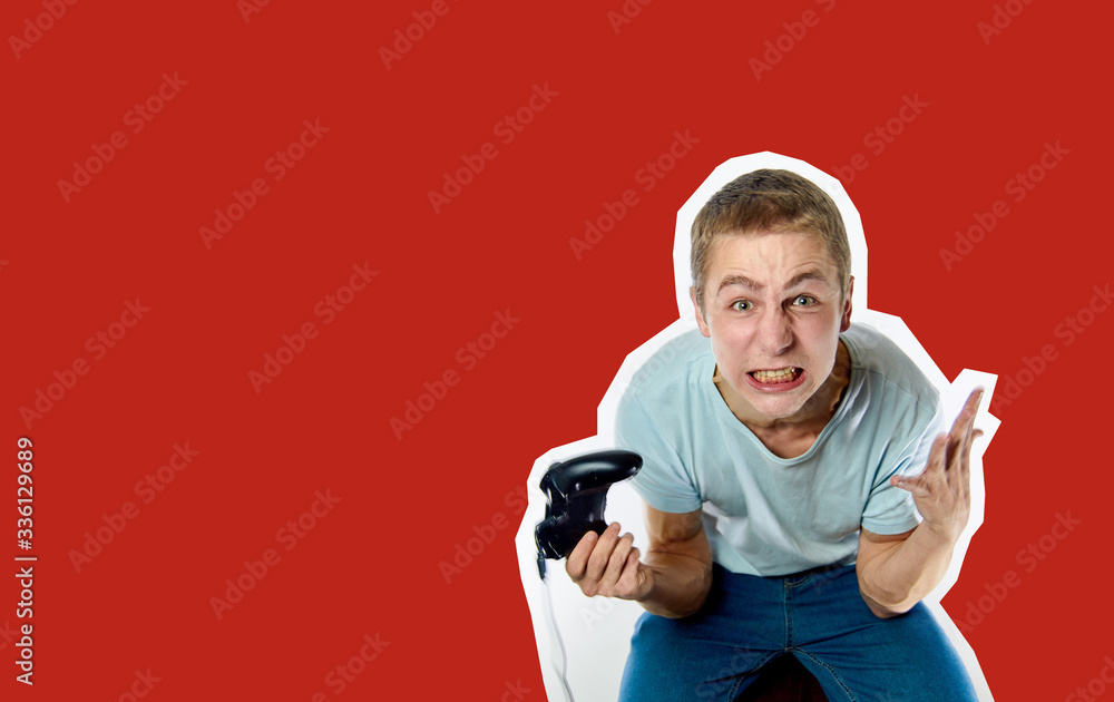 Emotional guy with a game joystick in his hands playing games. Collage in magazine style Emotional guy with a game joystick in his hands playing games. Collage in magazine style