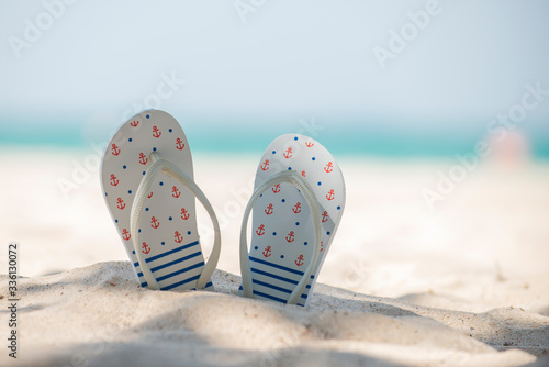 Sandal   slippers on sand at the beach