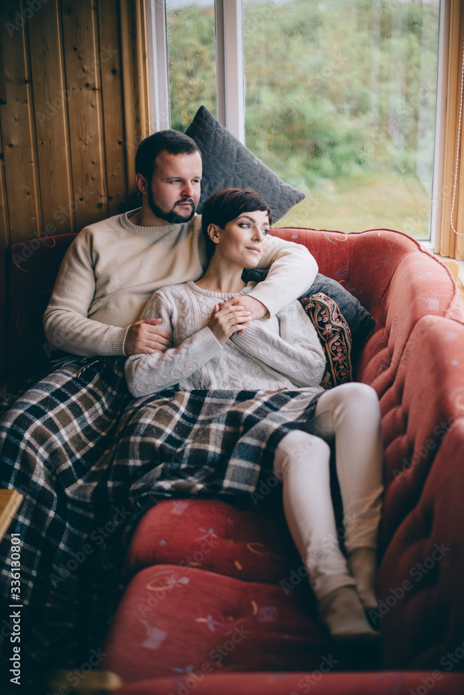 Romantic couple is lying on the sofa at home. Romantic couple is lying on the sofa at home.