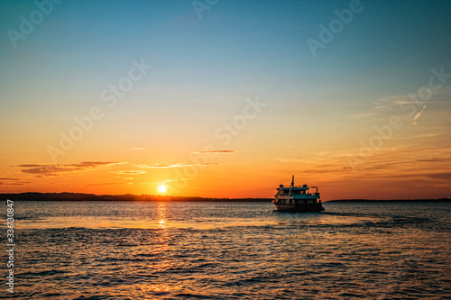 Sunset with ship sailing to the Brijuni Islands in Fazana, Croatia