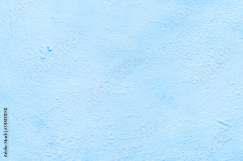Abstract background from light blue color painted on concrete wall.