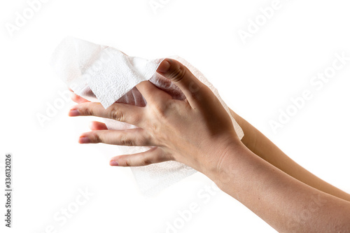 Cleaning hands with a wet towel on a white background for disinfection or moisturizing