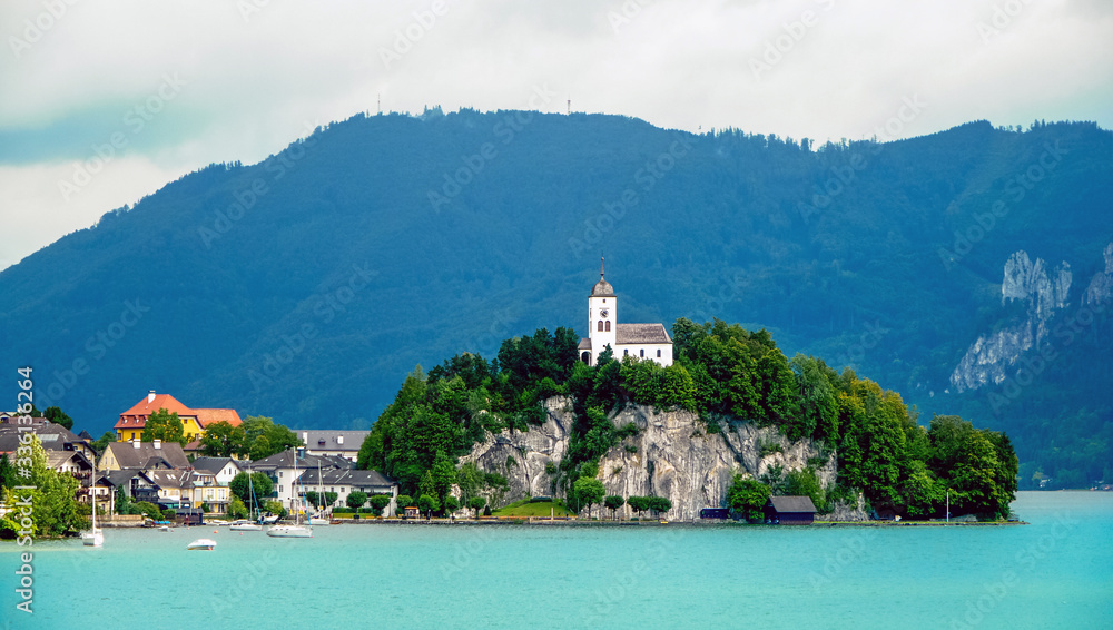 Traunkirchen, Upper Austria / Austria - August 2011: Skyline of the town and the church over the Traunsee Lake in Gmunden District