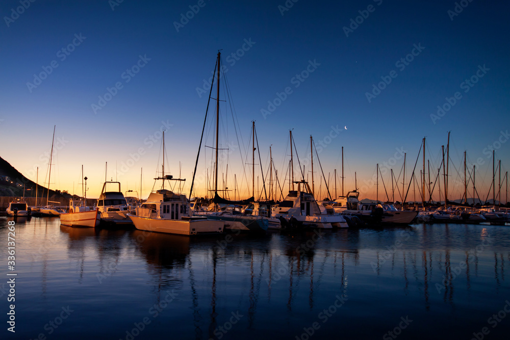 Boats anchored in the harbor, Gordons Bay South Africa.
