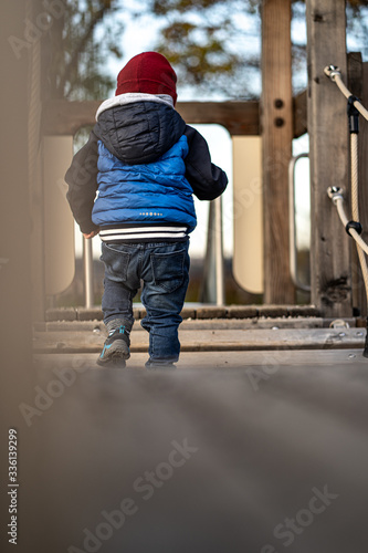 little boy playing on a bridge © StiF