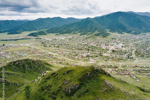 Onguday village in green valley of Altai Mountains, panoramic aerial view. Rural locality in Altai Republic, Siberia, Russia photo