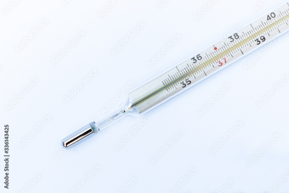 Thermometer on a white background, healthcare coronavirus, cancer, painand treatment, pharmaceutical medicine concept . Thermometer on a white background, healthcare coronavirus, cancer, painand treatment, pharmaceutical medicine concept .