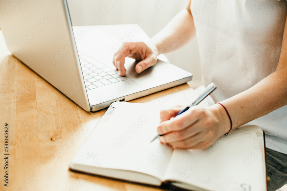 Hand holding credit card and and makes online shopping, work from home Hand holding credit card and and makes online shopping, work from home