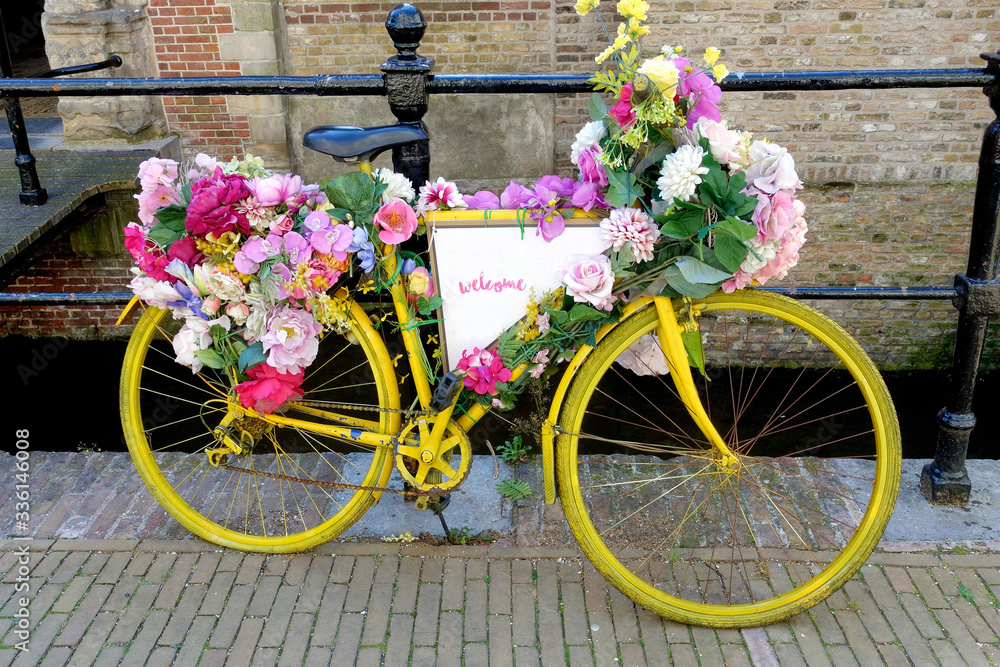 Old-fashioned Dutch city bike near a bridge over canal