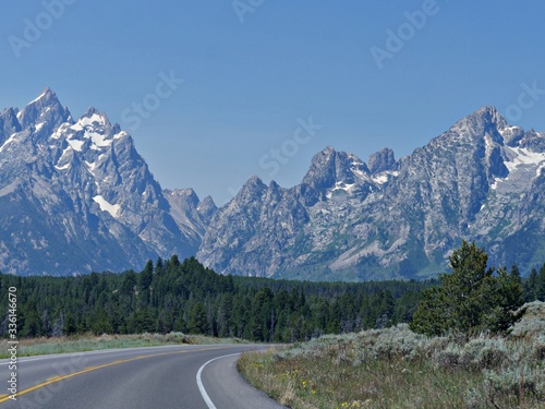 Rugged mountain ranges seen from the winding road at the Grand Teton National Park.