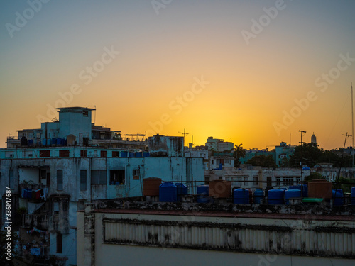 View of rooftops of houses in sunrise in Havana, Cuba
