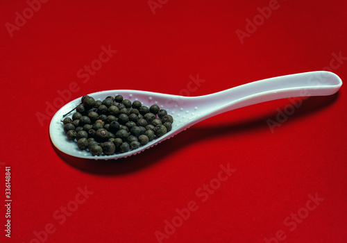 Black pepper on a red background