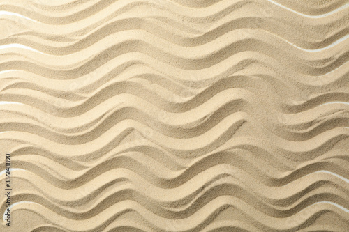 Dry sea sand with waves. Background. Summer. Vacation