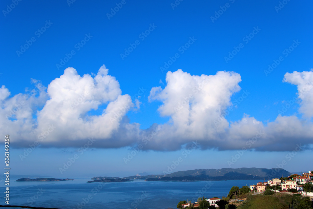 Skiathos island Greece 9/28/2019 .The island of Skiathos as seen by the Skopelos island, with wonderful clouds