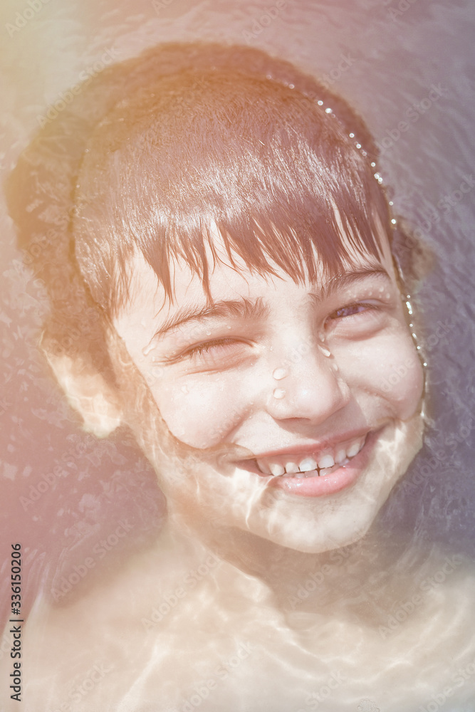 little boy in the water smiling concept of ecology and clean water little boy in the water smiling concept of ecology and clean water