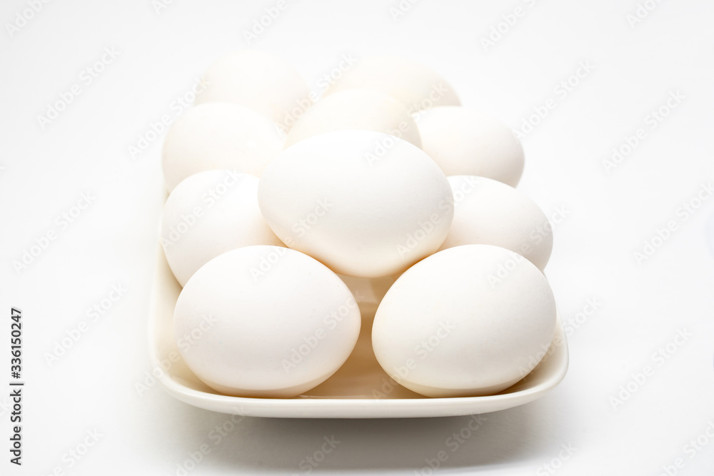 white eggs closeup. isolated white background. white eggs closeup. isolated white background.