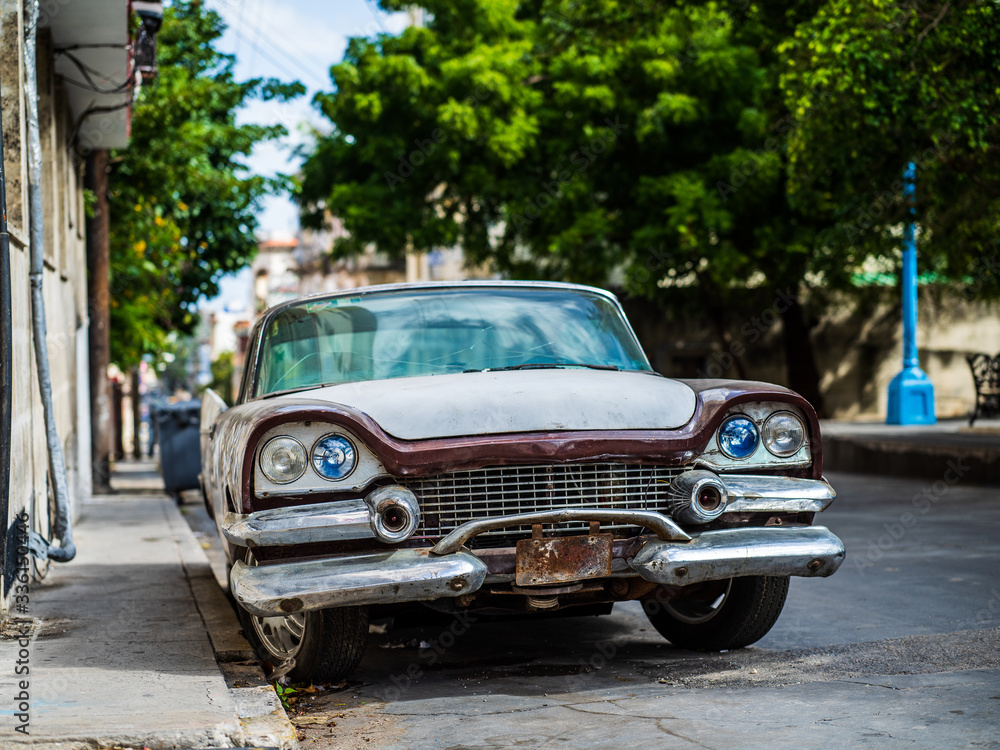 Old rusty American car parked on a street in Havana, Cuba Old rusty American car parked on a street in Havana, Cuba