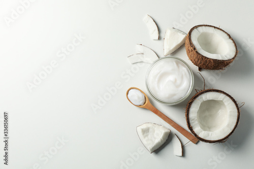 Coconut and cosmetics white background, top view