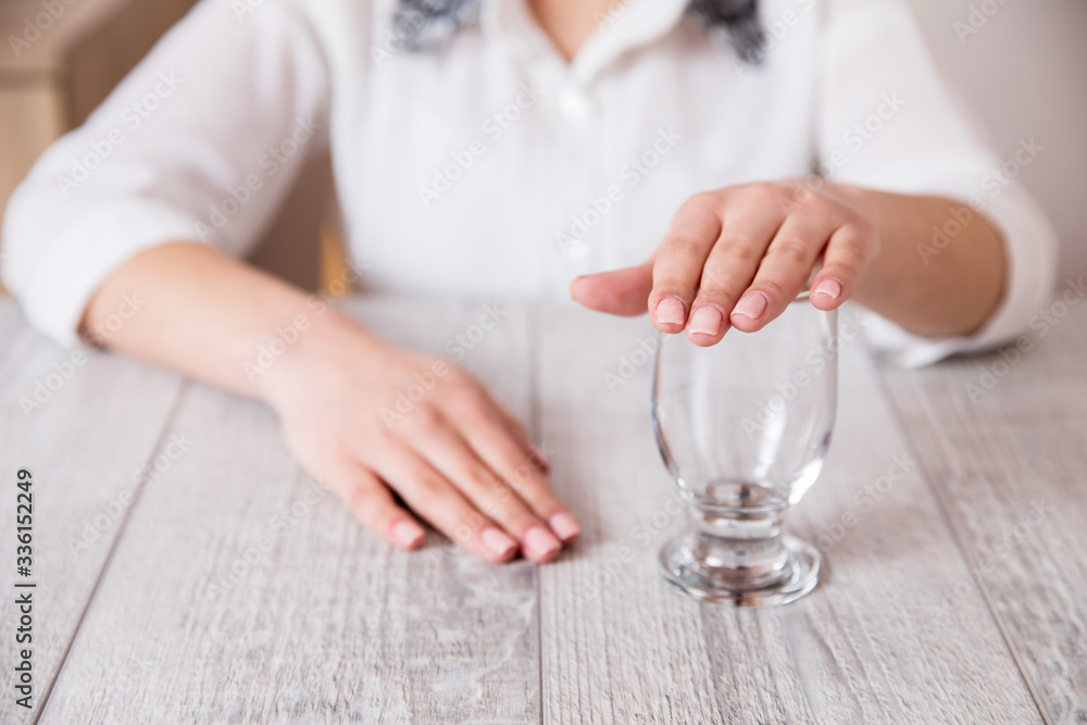 woman hand close the empty  glass