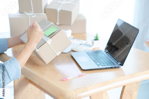 Business owner business start up online seller with packing cardboard box