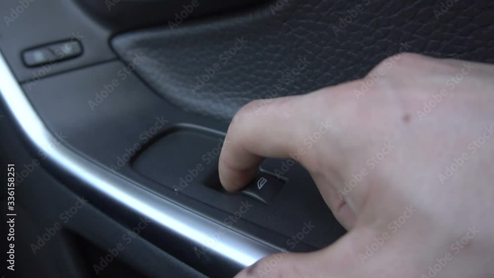 Man Is Pulling Lever Of Power Window In Automobile To Lifting Glass Man Is Pulling Lever Of Power Window In Automobile To Lifting Glass