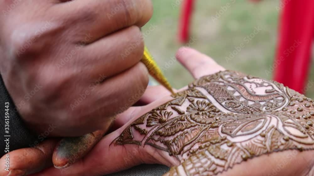 Traditional Indian temporary tattoo realized with henna paste during