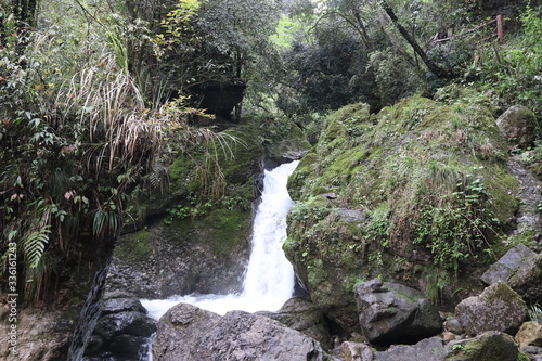 Beautiful landscape of a waterfall in a forest in a Mountain in Sichuan, China