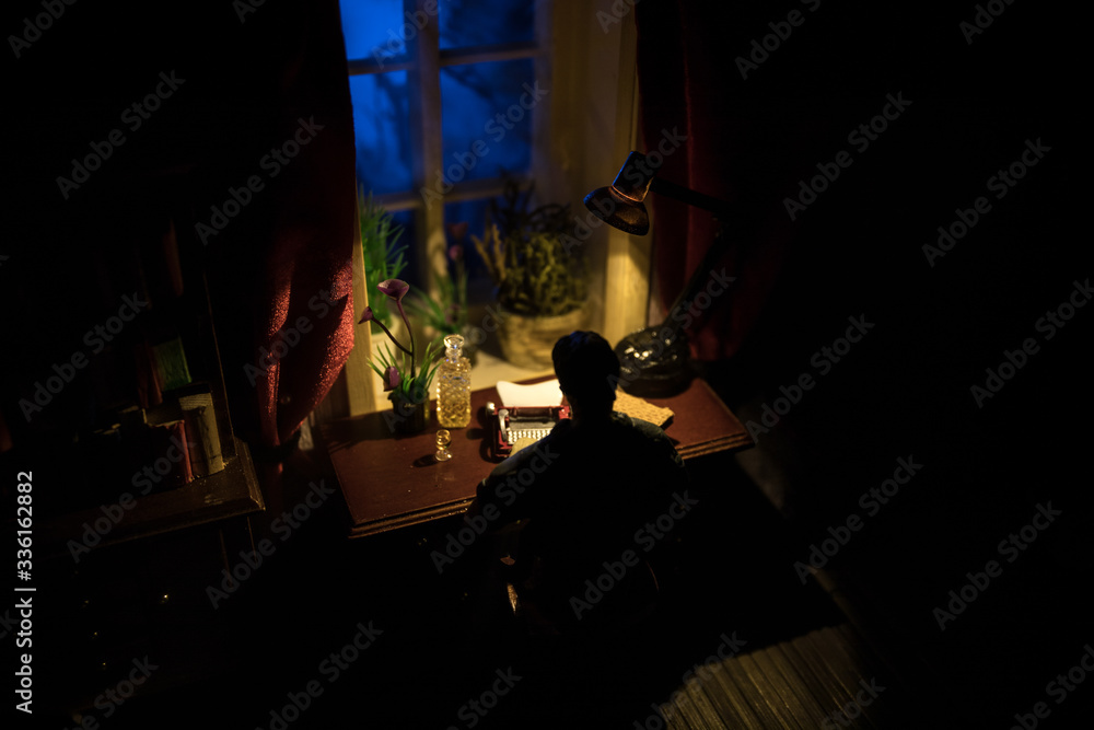 A realistic dollhouse living room with furniture and window at night. Artwork table decoration with handmade realistic dollhouse. A realistic dollhouse living room with furniture and window at night. Artwork table decoration with handmade realistic dollhouse.