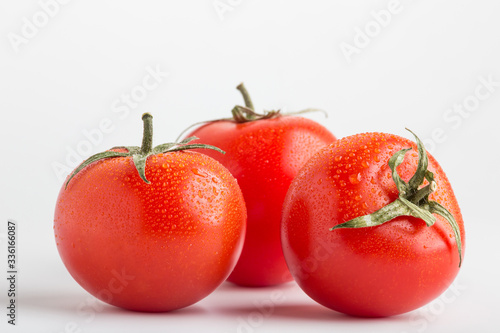 Wallpaper Mural Beautiful juicy red tomatoes on a white background Torontodigital.ca