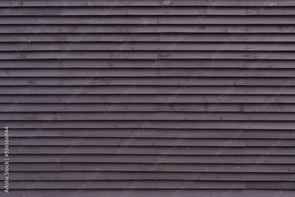 Scandinavian style of the wooden facade of the building. Black boards. Scandinavian style of the wooden facade of the building. Black boards.