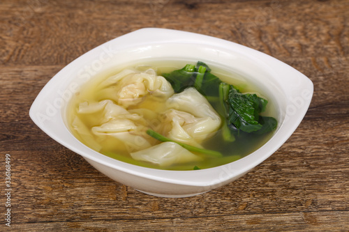 Asian traditional Wonton soup with herbs