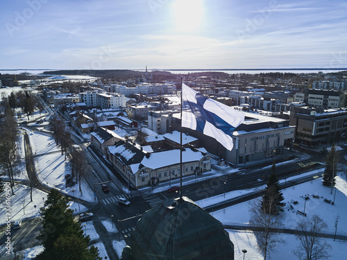 Obraz na płótnie Aerial view of Finnish flag on the tower of Town Hall in Joensuu w salonie