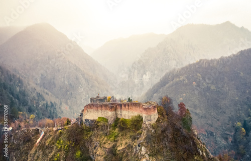 Fototapete Famous Poenari citadel on background of romania mountains