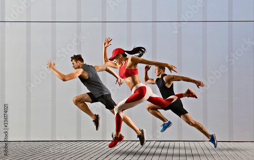 Men and woman running on urban background