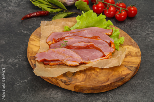 Sliced smoked duck breast served salad