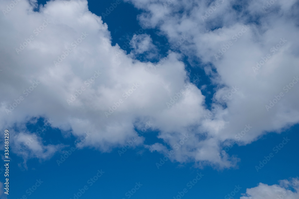 Blue sky covered with white clouds looked beautiful. Background.