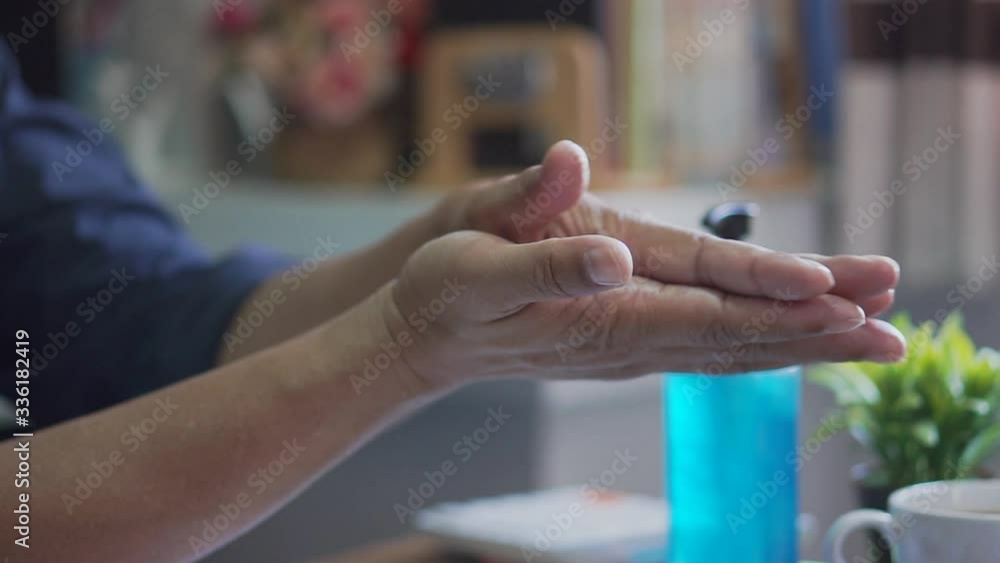 Covid-19 Virus Protection concept.Hand of Asian man washes and clean hands with alcohol gel To quarantine from the virus and bacteria during work from home. Covid-19 Virus Protection concept.Hand of Asian man washes and clean hands with alcohol gel To quarantine from the virus and bacteria during work from home.
