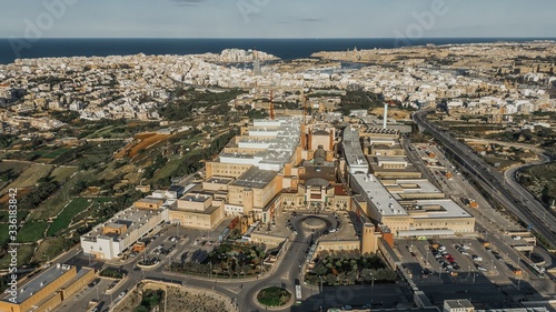 Aerial shot of Mater Dei Hospital in Malta surrounded by other buildings