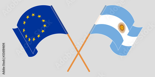 Crossed and waving flags of Argentina and the EU