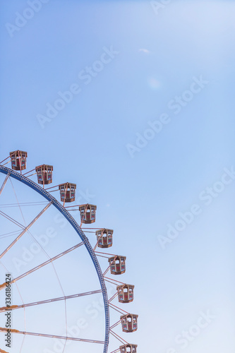 Germany, Bavaria, Munich, Low angle view of Ferris wheel?standing against clear sky photo