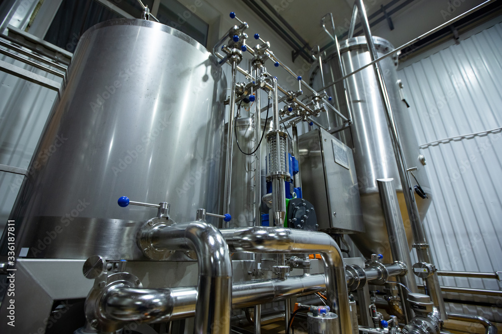Craft beer brewing equipment in brewery
Metal tanks, alcoholic drink production