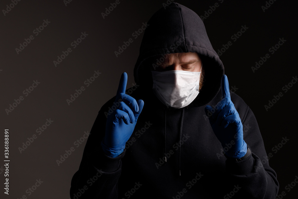 the masked white man held up his rubber-gloved fingers the masked white man held up his rubber-gloved fingers