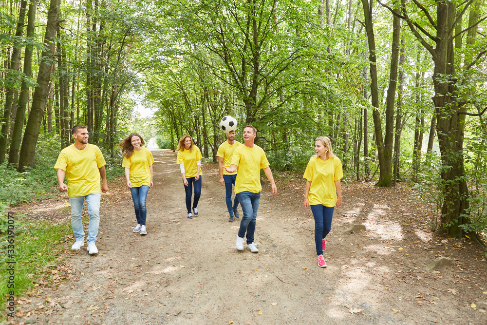 Fototapeta premium Group of young people are playing with a football