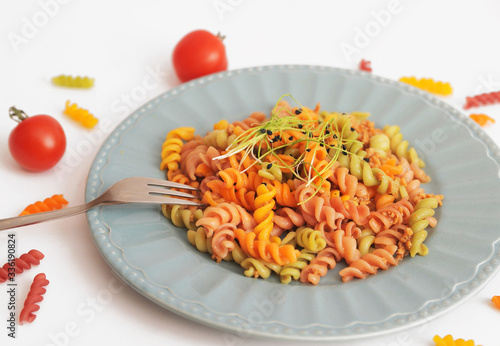 Pasta in white plate decorated for baby. Kid's menu.