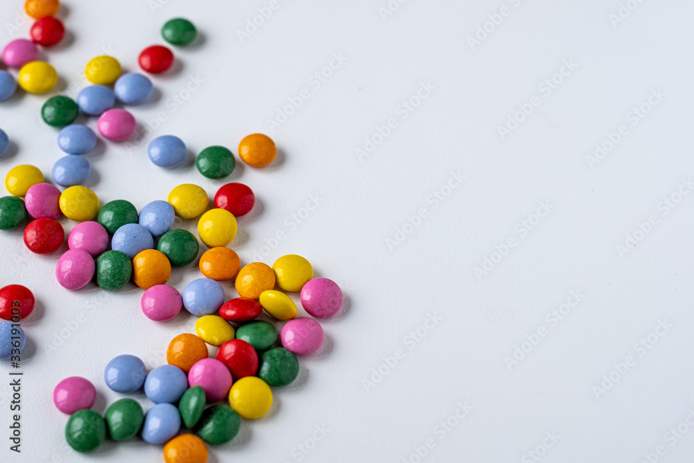 colorful medication and candies on white background colorful medication and candies on white background