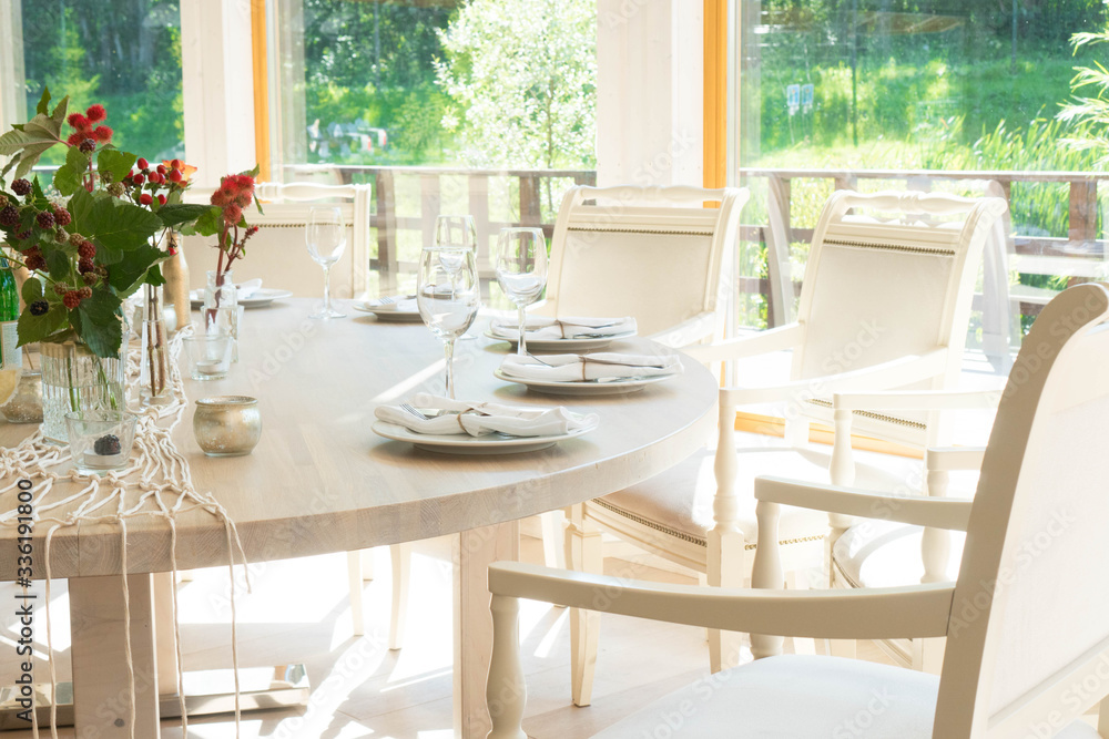 light decor of a festive table in a bright interior