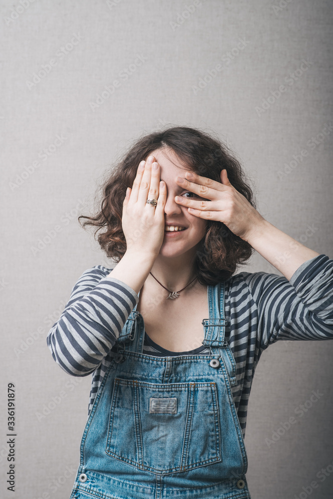 cute girl close one eye hand cute girl close one eye hand