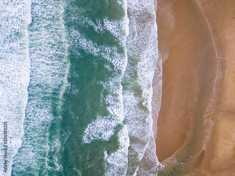 Top-down aerial of the waves lapping onto the South West coast of the UK, Croyde Bay Top-down aerial of the waves lapping onto the South West coast of the UK, Croyde Bay