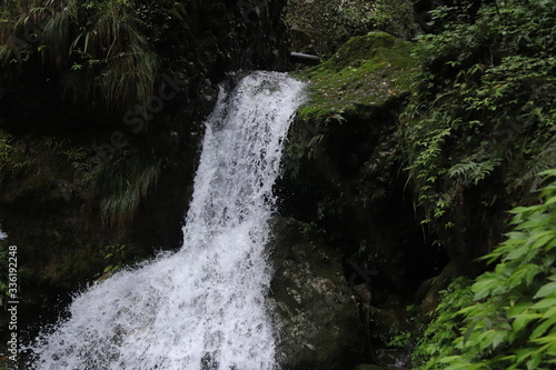 Beautiful landscape of a waterfall in a forest in a Mountain in Sichuan  China