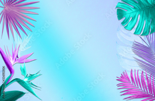 Colorful tropical plants on bright background, flat lay. Creative design
